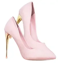 Blush pink suede pointed-toe stiletto pumps with metallic gold tapered heels against a white background