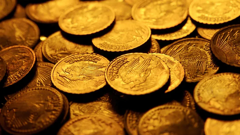 A close-up of a bunch of gold coins.