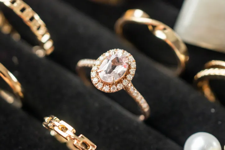 A sparkling gold diamond ring on display in a jewelry case.