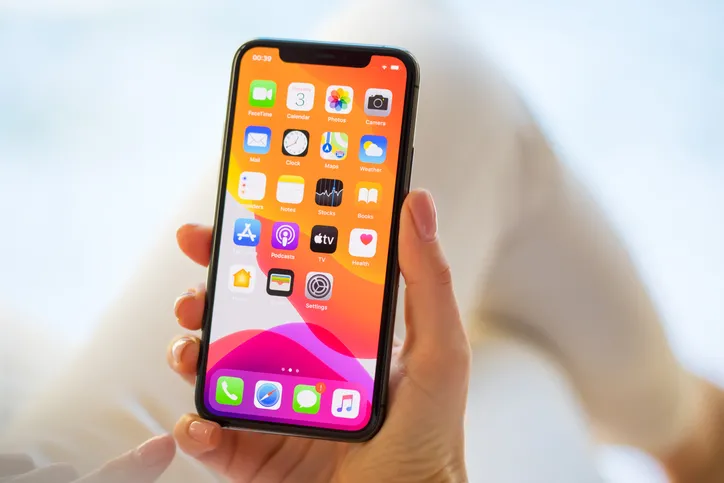 A woman using Apple iPhone 11 Pro.